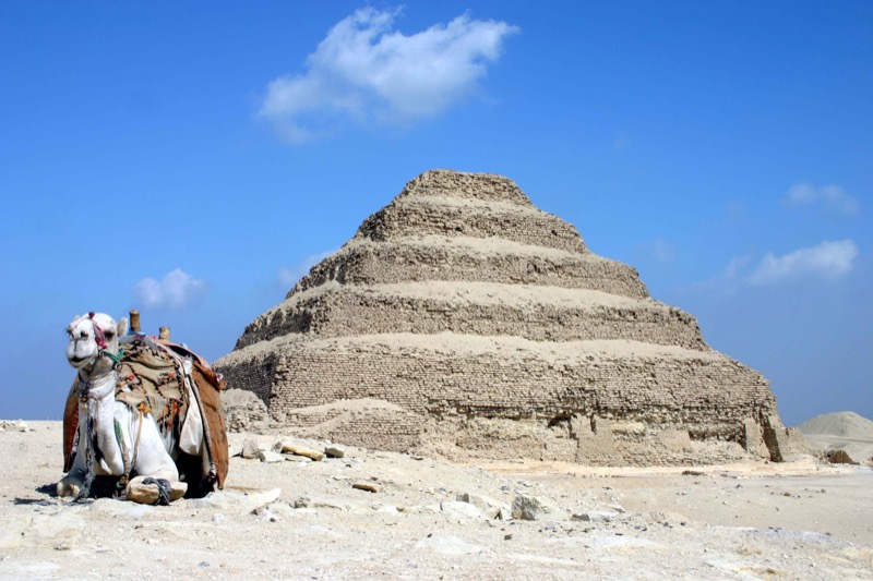 The stepped pyramid of Djoser at Saqqara against a blue sky